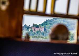 Train passing Dunster Castle